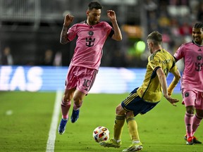 Inter Miami's Argentine forward #10 Lionel Messi fights for the ball with Real Salt Lake's defender #02 Andrew Brody during the MLS football match between Inter Miami and Real Salt Lake at Chase Stadium in Fort Lauderdale, Florida, February 21, 2024. (Photo by CHANDAN KHANNA/AFP via Getty Images)