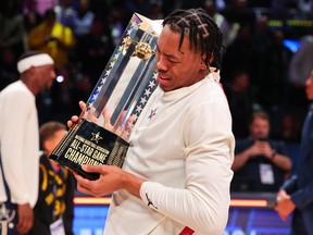 Scottie Barnes #4 of the Toronto Raptors and Eastern Conference All-Stars lifts the trophy after defeating the Western Conference All-Stars during the 2024 NBA All-Star Game at Gainbridge Fieldhouse on February 18, 2024 in Indianapolis, Indiana. (Photo by Stacy Revere/Getty Images)