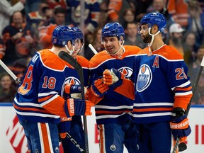 The Edmonton Oilers' Cody Ceci (5) celebrates his goal against the Detroit Red Wings during first period NHL action at Rogers Place, in Edmonton Tuesday Feb. 13, 2024.