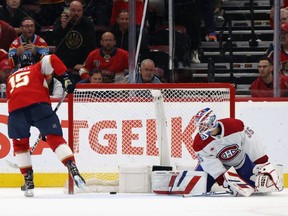 Anton Lundell #15 of the Florida Panthers scores a game-winning shootout goal against the Montreal Canadiens at Amerant Bank Arena on February 29, 2024 in Sunrise, Florida. The Panthers defeated the Canadiens 4-3 in the shootout.