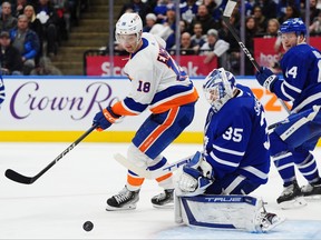 New York Islanders' Pierre Engvall looks for the rebound from Maple Leafs goaltender Ilya Samsonov during the third period in Toronto on Monday, Feb. 5, 2024.
