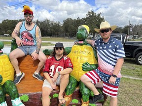 This image provided by Tyler Watts shows Florida Man Games competitors, from left, Joshua Barr, Michael Selvester and Brandon Watts posing Jan. 27, 2024, in Inverness, Fla