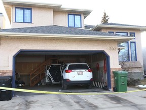 Calgary police contain a house in 200 block of Edgepark Way N.W. in Calgary on Thursday, January 10, 2019.
