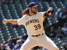 Milwaukee Brewers starting pitcher Corbin Burnes (39) delivers against the St. Louis Cardinals at American Family Field.