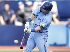 Daulton Varsho of the Blue Jays hits a two-RBI single against the Tampa Bay Rays at Rogers Centre on September 30, 2023 in Toronto.