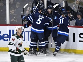 The Jets celebrate a goal by Mason Appleton on Tuesday versus the rival Wild.