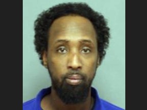 Liban Mohamud, 42, of Toronto, is wanted on a Canada-wide warrant for second-degree murder in connection with the killing of Edwin John Redmond, 27, on Saturday, Feb. 10, 2024.