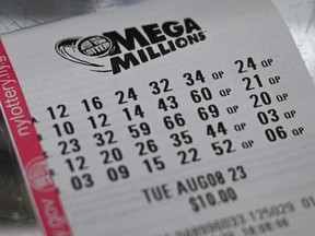 A Mega Millions lottery ticket is seen in New York City on Aug. 8, 2023.