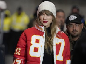 Taylor Swift wears a Kansas City Chiefs Travis Kelce jacket as she arrives before an NFL wild-card playoff football game between the Chiefs and the Miami Dolphins, Saturday, Jan. 13, 2024, in Kansas City, Mo.