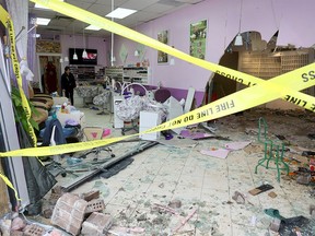 Calgary Fire and police investigate after a SUV drove through the Jack’s Nails and Spa business at 1440 52 St. N.E. in Calgary on Tuesday, February 6, 2024.