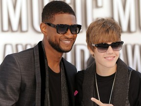 Usher and Justin Bieber arrive on the red carpet for the 2010 MTV Video Music Awards at the Nokia Theater in Los Angeles on Sept. 12, 2010.