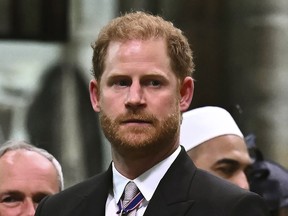Britain's Prince Harry, Duke of Sussex looks on as Britain's King Charles III leaves Westminster Abbey after coronation in central London Saturday, May 6, 2023.