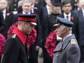 Britain's King Charles III and Prince William attend the Remembrance Sunday service at the Cenotaph on Whitehall in London, Sunday, Nov. 12, 2023. King Charles III has been diagnosed with a form of cancer and has begun treatment, Buckingham Palace said Monday Feb. 5, 2024. Less than 18 months into his reign, the 75-year-old monarch will suspend public duties but will continue with state business, and won't be handing over his constitutional roles as head of state.