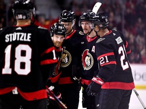 Senators defenceman Thomas Chabot, second from right, celebrates with teammates after scoring his team's first goal of the game during the second period of action against the Golden Knights.