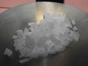 Crystal meth, also called methamphetamine, sits on a scale to be weighed.