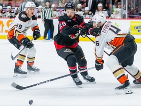 Ottawa Senators defenseman Erik Brannstrom (26) losses possession of the puck as Anaheim Ducks defenseman Ilya Lyubushkin (46) works on defence during the first period on Thursday. Postmedia
