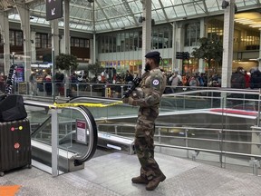 A soldier patrols inside the Gare de Lyon station after an attack, Saturday, Feb. 3, 2024 in Paris. A man injured three people Saturday in a stabbing attack at the major Gare de Lyon train station in Paris, another nerve-rattling security incident in the Olympic host city before the Summer Games open in six months.