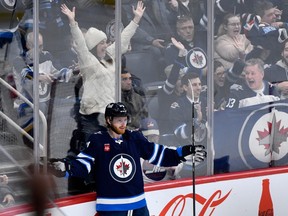 Winnipeg Jets' Kyle Connor (81) celebrates his goal against the St. Louis Blues during the first period of NHL action in Winnipeg on Tuesday Feb. 27, 2024.