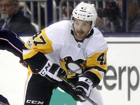 Then Pittsburgh Penguins forward Adam Johnson in action during an NHL hockey game in Columbus, Ohio, Friday, Sept. 22, 2017.