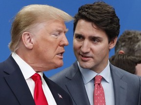 Donald Trump, left, and Canadian Prime Minister Justin Trudeau talk prior to a NATO round able meeting at The Grove hotel and resort in Watford, Hertfordshire, England, Wednesday, Dec. 4, 2019.