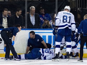 Tampa Bay Lightning medical staff tend to Mikhail Sergachev after he sustained a leg injury against the New York Rangers on Wednesday, Feb. 7, 2024 in New York.