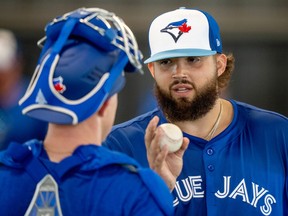 Toronto Blue Jays pitcher Alek Manoah talks about his pitches following a throwing session during Spring Training action in Dunedin, Fla., Thursday, Feb. 15, 2024.