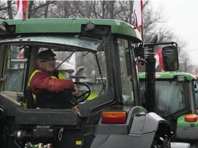 Polish farmers, angry at EU agrarian policy and cheap Ukraine produce imports which, they say, are undercutting their livelihoods, drive their heavy-duty tractors in protest outside the office of the regional governor, in Poznan, western Poland, Friday Feb. 9, 2024.