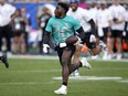 AFC wide receiver Tyreek Hill, of the Miami Dolphins, runs after the catch during the flag football event at the NFL Pro Bowl football game, Sunday, Feb. 4, 2024, in Orlando.