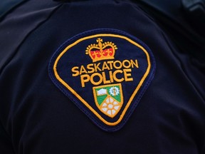 A Saskatoon Police Service badged is shown on officers' uniform in Saskatoon, Sask., on Friday, May 5, 2023. askatchewan's police watchdog is investigating after a Saskatoon police officer shot and injured a 34-year-old man.