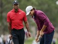 Tiger Woods, left, watches his son Charlie putt during the final round of the PNC Championship Sunday, Dec. 17, 2023, in Orlando, Fla.