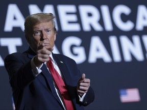 Republican presidential candidate, former U.S. President Donald Trump gestures to supporters after speaking at a Get Out The Vote rally at the North Charleston Convention Center on Feb. 14, 2024 in North Charleston, S.C.