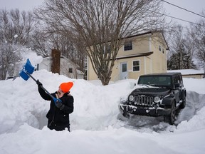 Kat MacIsaac, a nurse at the Cape Breton Regional Hospital's dialysis unit, shovels out her driveway in Sydney, N.S., on Wednesday Feb. 14, 2024.