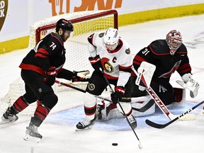 Ottawa Senators left winger Brady Tkachuk (7) tries to get in position to take a shot in front of Carolina Hurricanes goaltender Frederik Andersen.