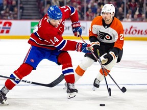 Canadiens Nick Suzuki skates past Philadelphia Flyers' Ryan Poehling in Montreal on Thursday, March 28, 2024. The Montreal captain scored his 30th goal of the season in the 4-1 win.