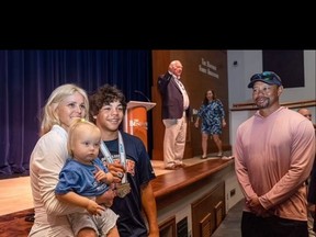 Tiger Woods (right) attended a ceremony for son Charlie with ex-wife Elin Nordegren.