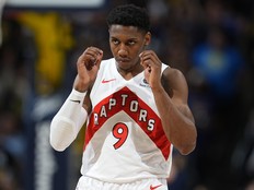 Toronto Raptors guard RJ Barrett reacts during a game.