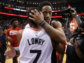 San Antonio Spurs' DeMar DeRozan hugs his former Toronto Raptors teammate Kyle Lowry.