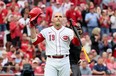 Joey Votto acknowledges the crowd before his first at bat of the season in the second inning against the Colorado Rockies at Great American Ball Park on June 19, 2023 in Cincinnati, Ohio.