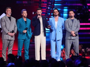 (L-R) Joey Fatone, Lance Bass, Justin Timberlake, JC Chasez, and Chris Kirkpatrick of *NSYNC speak onstage the 2023 MTV Video Music Awards at Prudential Center on Sept.12, 2023 in Newark, New Jersey.