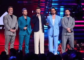 (L-R) Joey Fatone, Lance Bass, Justin Timberlake, JC Chasez, and Chris Kirkpatrick of *NSYNC speak onstage the 2023 MTV Video Music Awards at Prudential Center on Sept.12, 2023 in Newark, New Jersey.