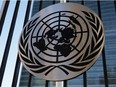 The United Nations logo is seen on a fence at the United Nations headquarters on December 12, 2023 in New York City.