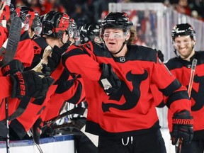 Tyler Toffoli #73 of the New Jersey Devils is congratulated by his teammates after scoring a goal against the Philadelphia Flyers during the first period during the 2024 Navy Federal Credit Union Stadium Series at MetLife Stadium on February 17, 2024 in East Rutherford, New Jersey. (Photo by Bruce Bennett/Getty Images)
