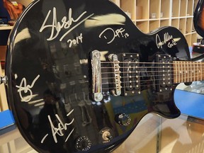 A Les Paul guitar signed by every member of Guns N' Roses is on auction this week to support Goodwill Industries of Alberta.