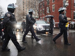 Police gather as people participate in a demonstration and march to demand that Israel end its war in Gaza and agree to a cease-fire on March 2, 2024 in New York City. (Photo by Spencer Platt/Getty Images)