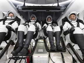 In this handout provided by the National Aeronautics and Space Administration (NASA), Roscosmos cosmonaut Konstantin Borisov, left, ESA (European Space Agency) astronaut Andreas Mogensen, NASA astronaut Jasmin Moghbeli, and Japan Aerospace Exploration Agency (JAXA) astronaut Satoshi Furukawa are seen inside the SpaceX Dragon Endeavour spacecraft onboard the SpaceX recovery ship MEGAN shortly after having landed in the Gulf of Mexico, on March 12, 2024 off the coast of Pensacola, Florida.
