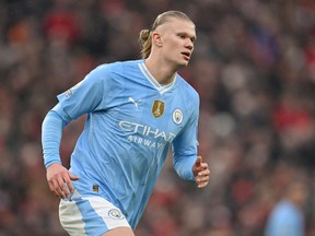 Erling Haaland of Manchester City looks on during the Premier League match between Liverpool FC and Manchester City at Anfield on March 10, 2024 in Liverpool, England.