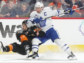 Maple Leafs’ John Tavares collides with Flyers’ Travis Konecny in Philadelphia on Tuesday night.