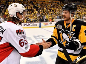 PITTSBURGH, PA - MAY 25: (L-R) Erik Karlsson #65 of the Ottawa Senators congratulates Sidney Crosby #87 of the Pittsburgh Penguins after winning Game Seven of the Eastern Conference Final during the 2017 NHL Stanley Cup Playoffs at PPG PAINTS Arena on May 25, 2017 in Pittsburgh.