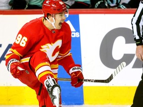 Calgary Flames' Andrei Kuzmenko scores on Seattle Kraken goalie Philipp Grubauer earlier this season.