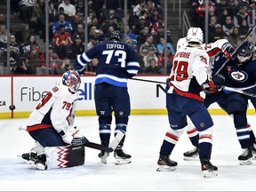 Winnipeg Jets' Alex Iafallo (9) scores on Washington Capitals goaltender Charlie Lindgren (79) during the second period of NHL action in Winnipeg on Monday March 11, 2024. THE CANADIAN PRESS/Fred Greenslade